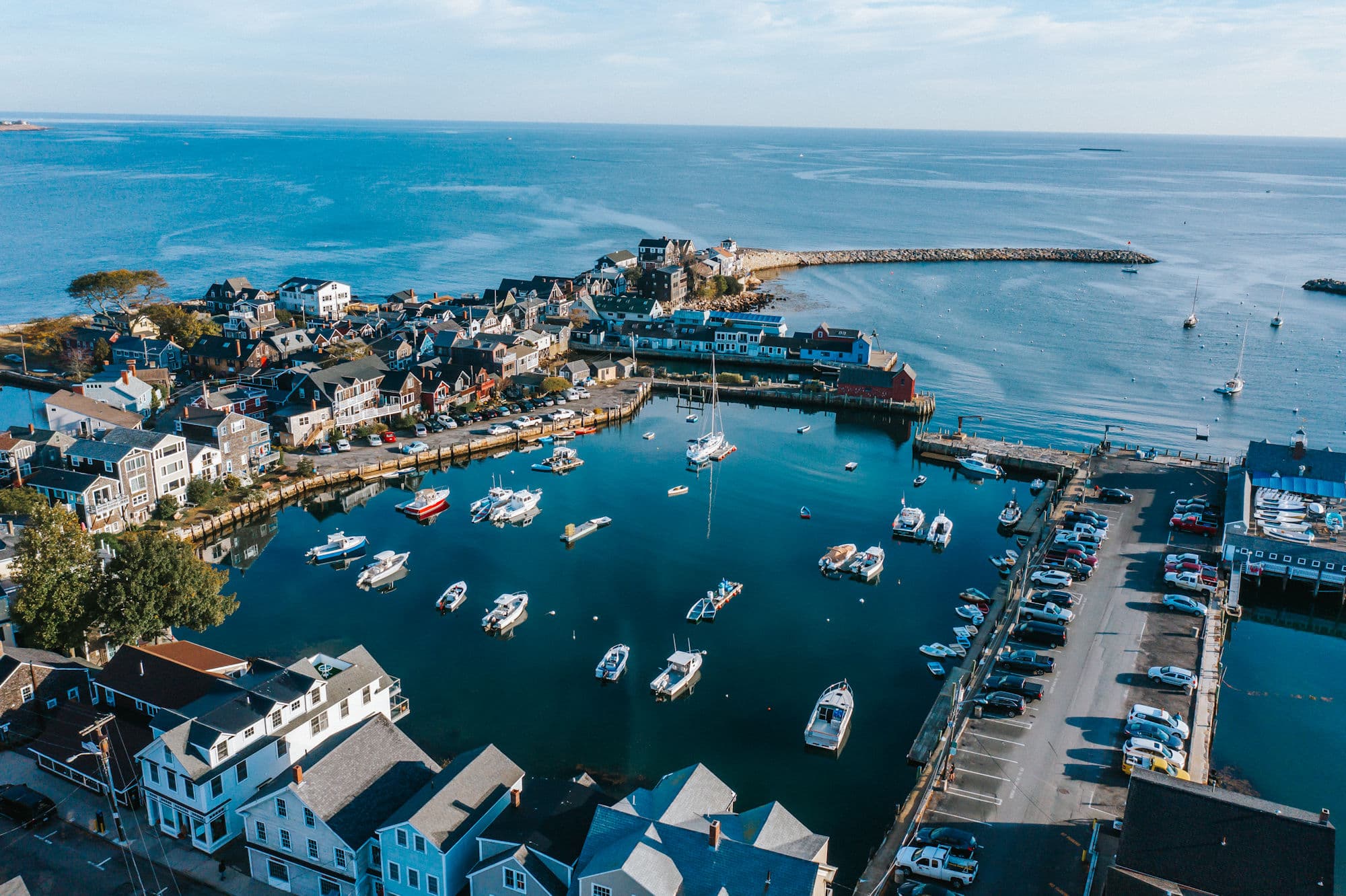 Drone aerial of Rockport harbor with Bearskin Neck and the breakwater