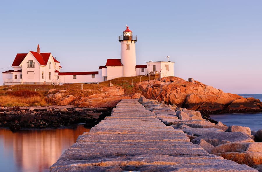 Eastern Point Lighthouse and breakwater at sunset, Gloucester