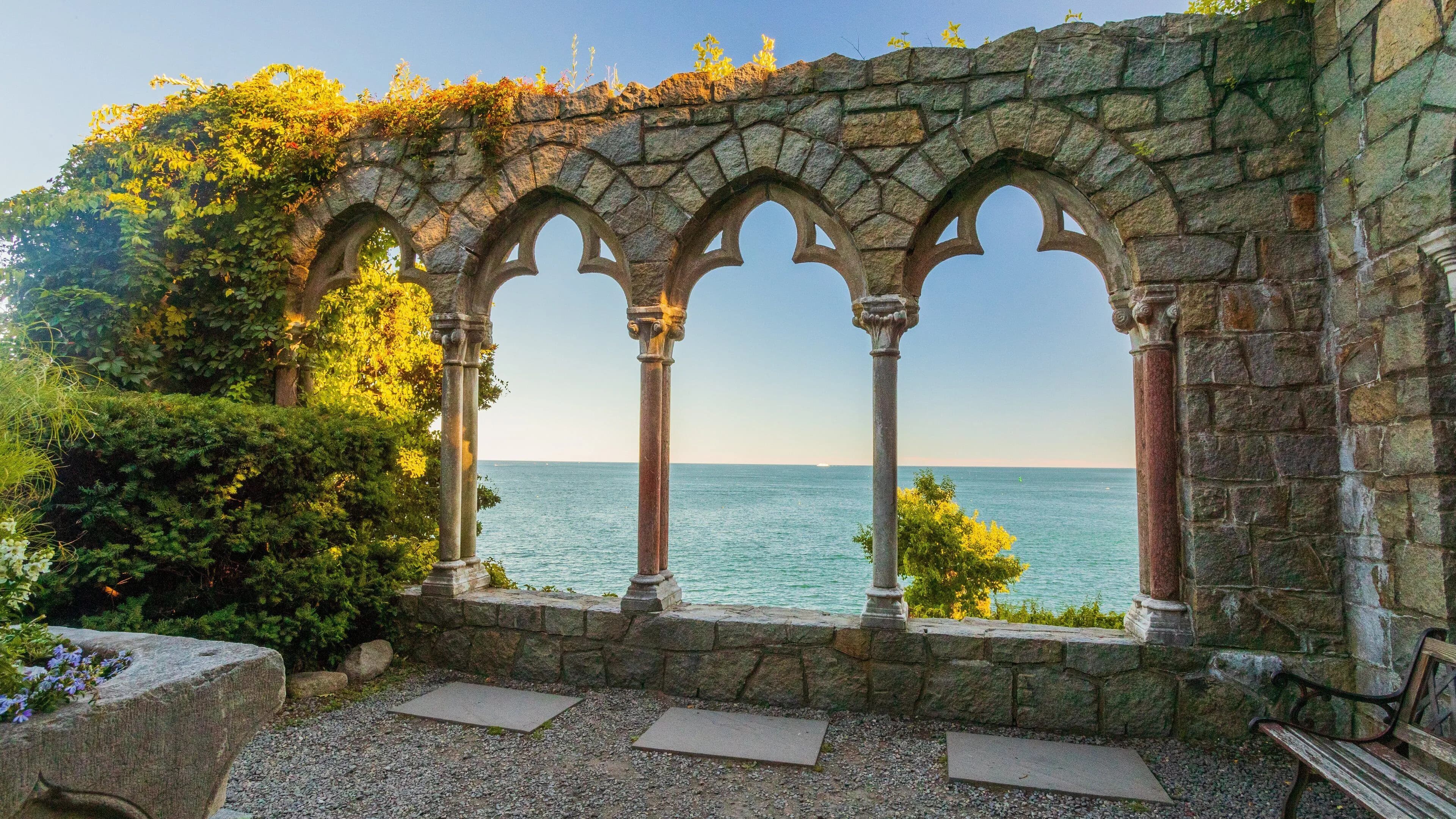 Stone arches at Hammond Castle frame the Atlantic, Magnolia